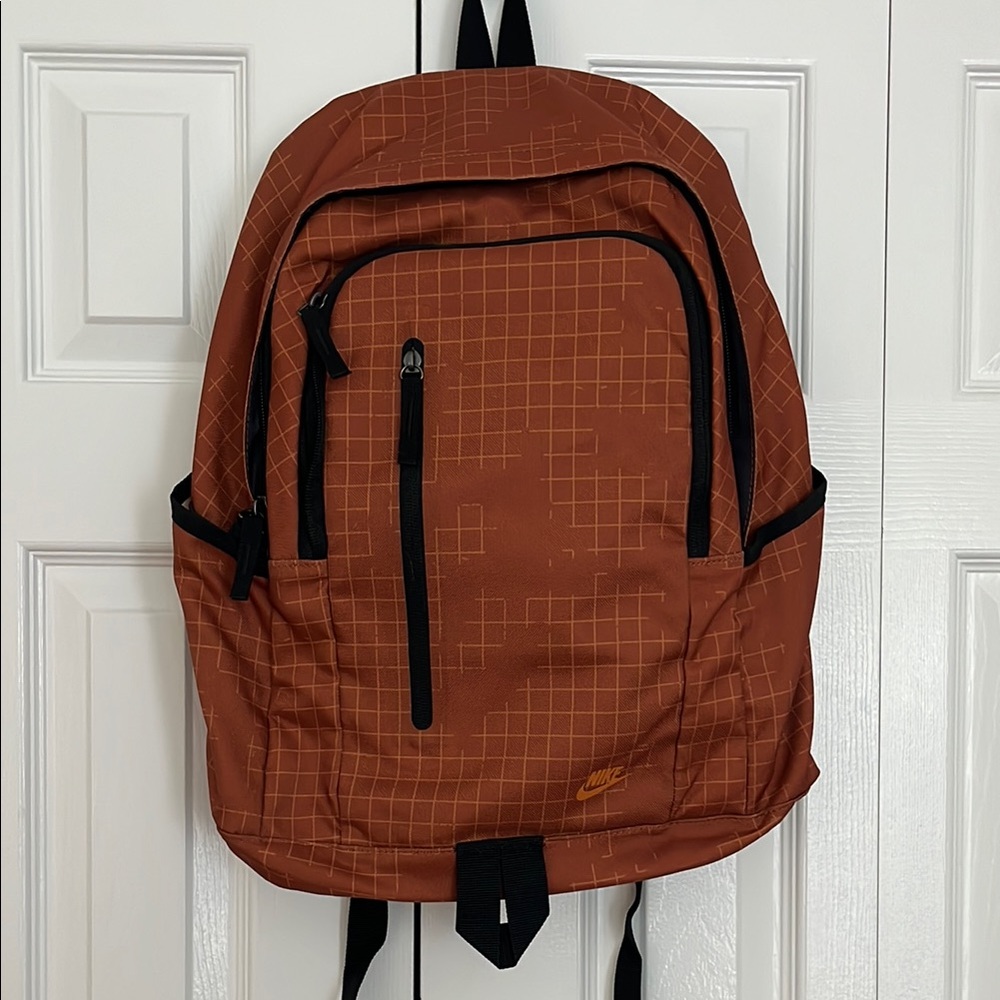 Nike Brown Backpack with Adjustable Straps and Durable Material